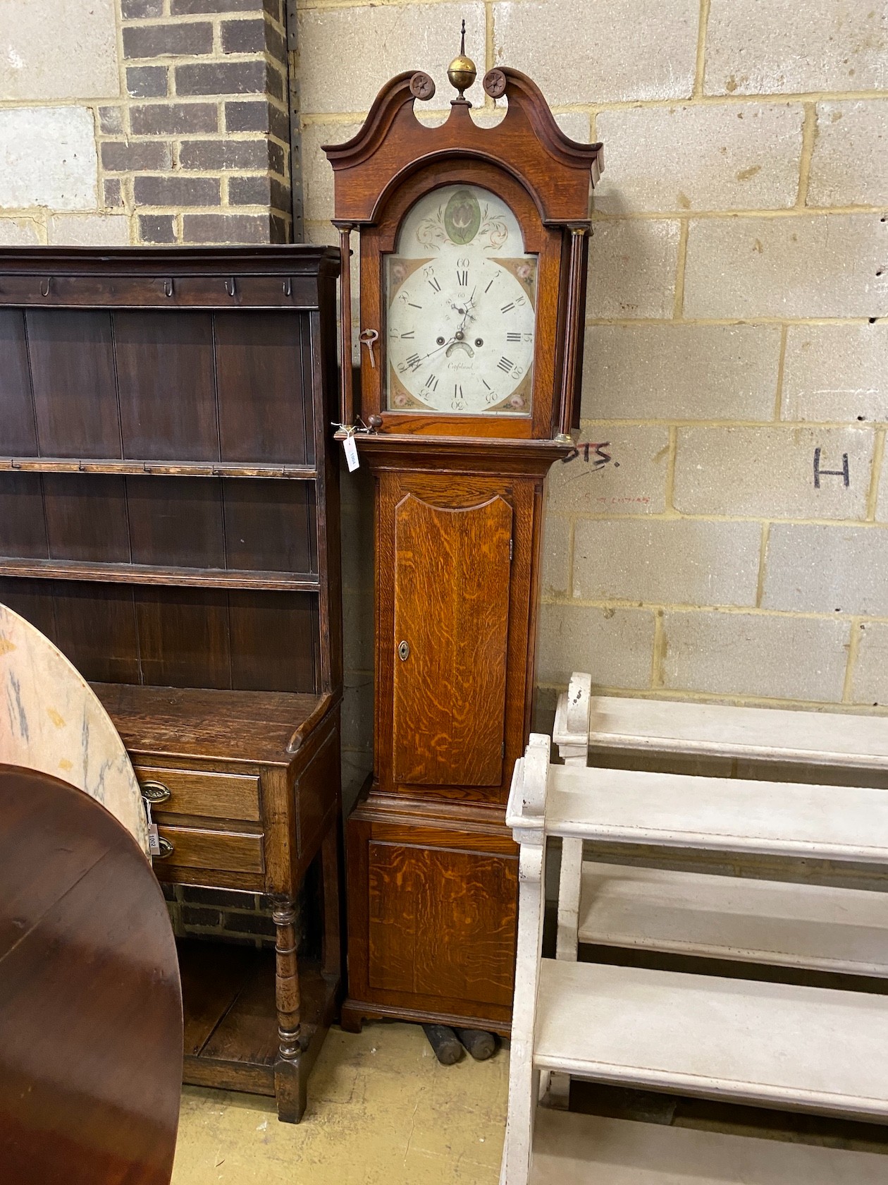 An early 19th century oak 8 day longcase clock, fusee movement, dial marked Crossland, height 236cm